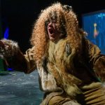 Performer dressed as a lion from the wizard of oz.